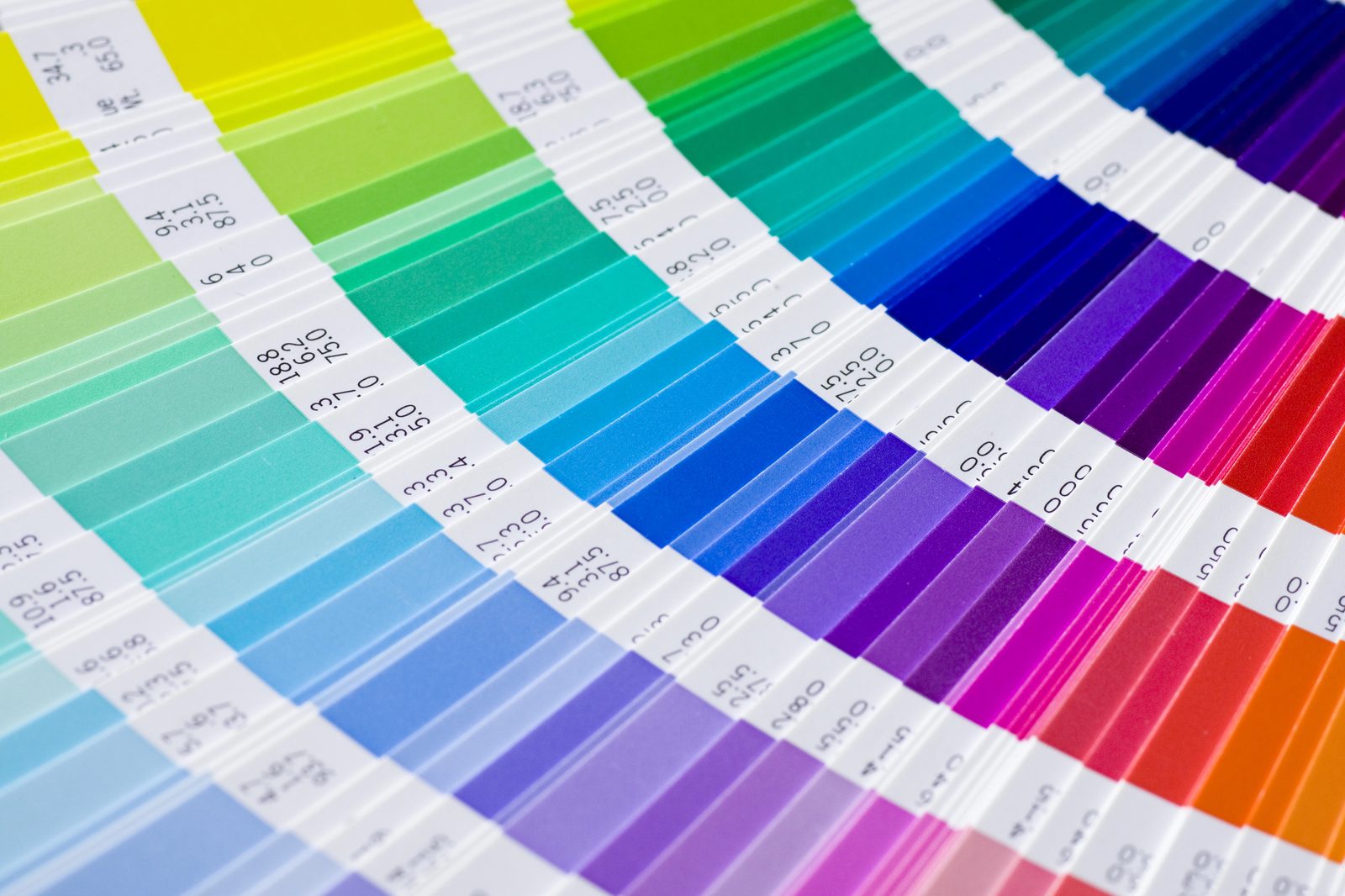 Fanned Pantone color guide showing ink swatches across the spectrum